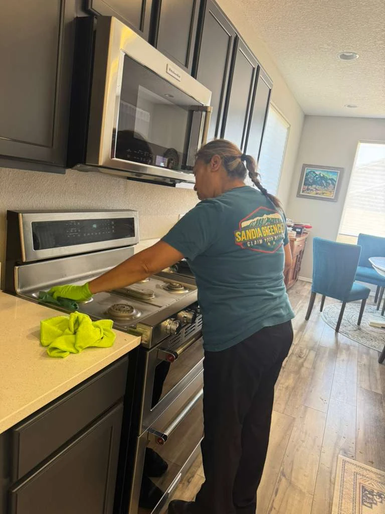 Sandia Green Clean three-person team working through a Bernalillo home with color-coded microfiber and green products
