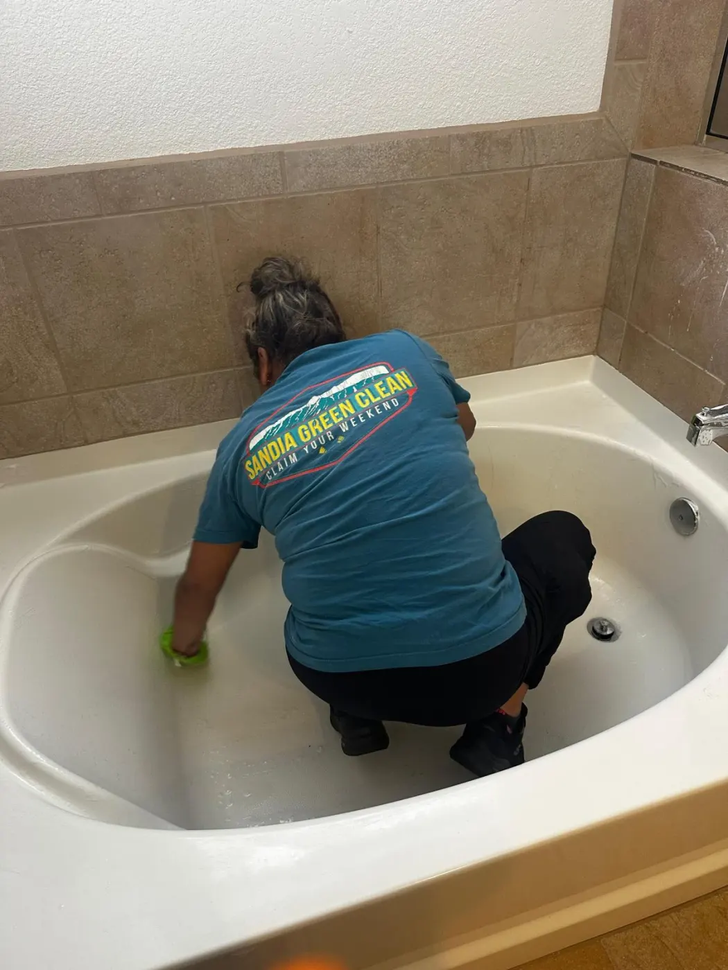 Sandia Green Clean three-person team preparing eco-friendly supplies before a home cleaning in Albuquerque