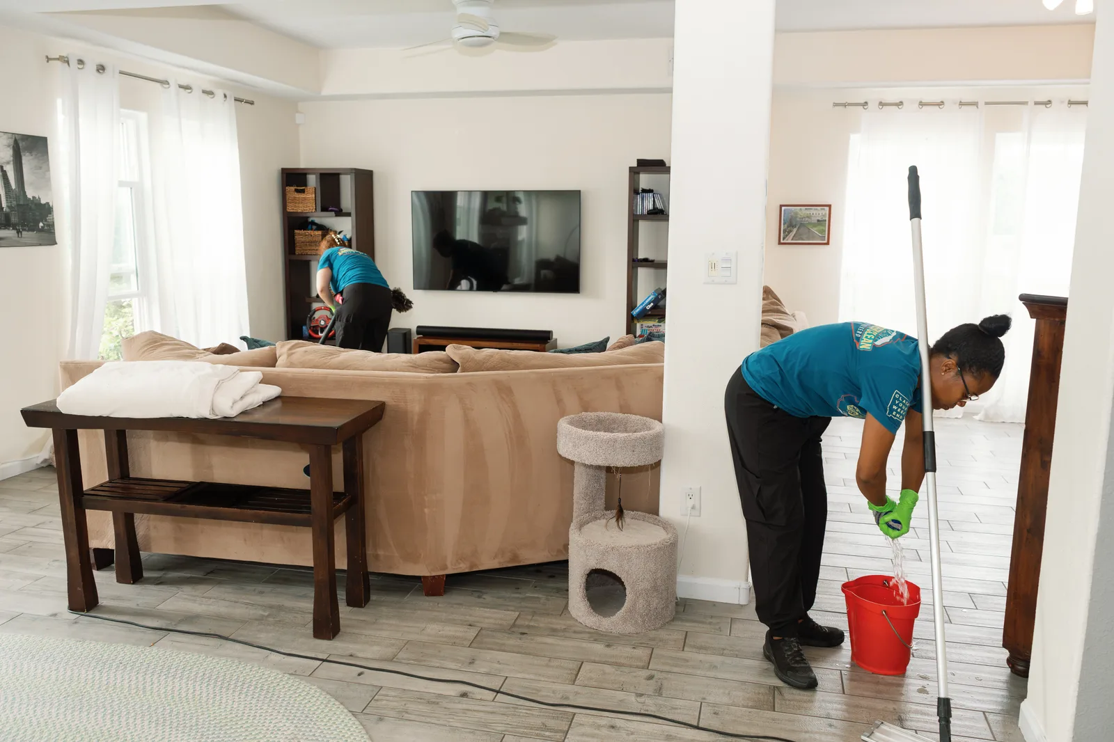 Sandia Green Clean cleaner mopping hard floors in a living area