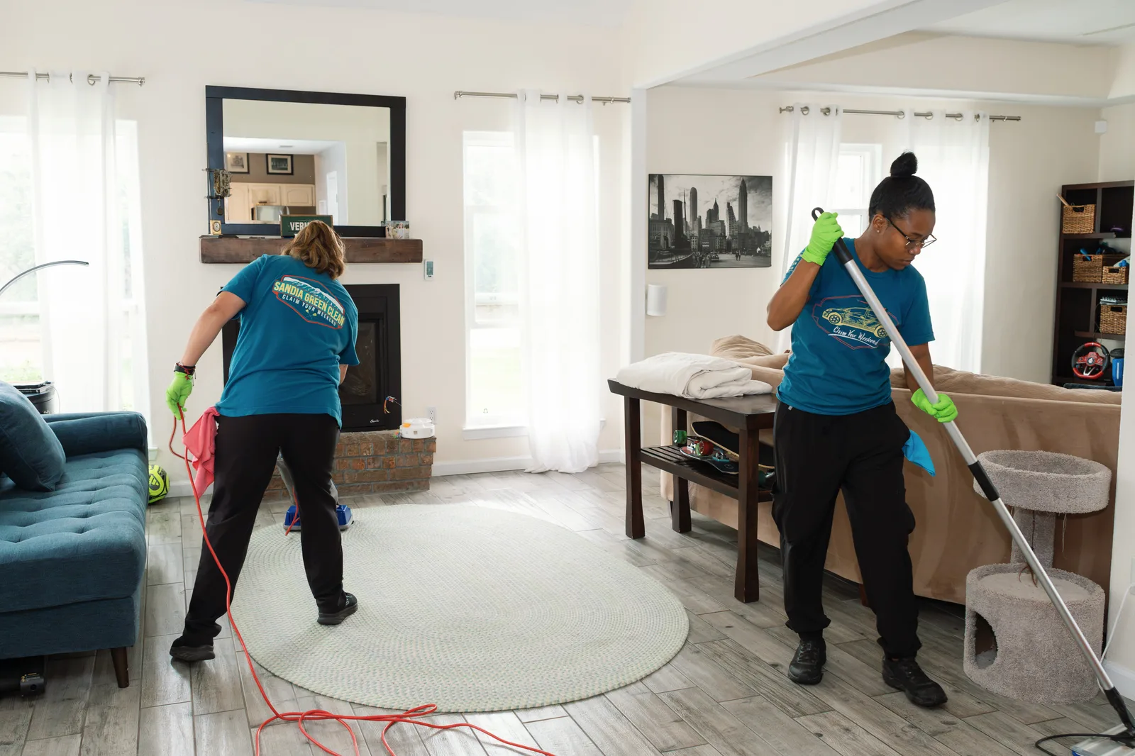 Sandia Green Clean two-person team cleaning a living room together